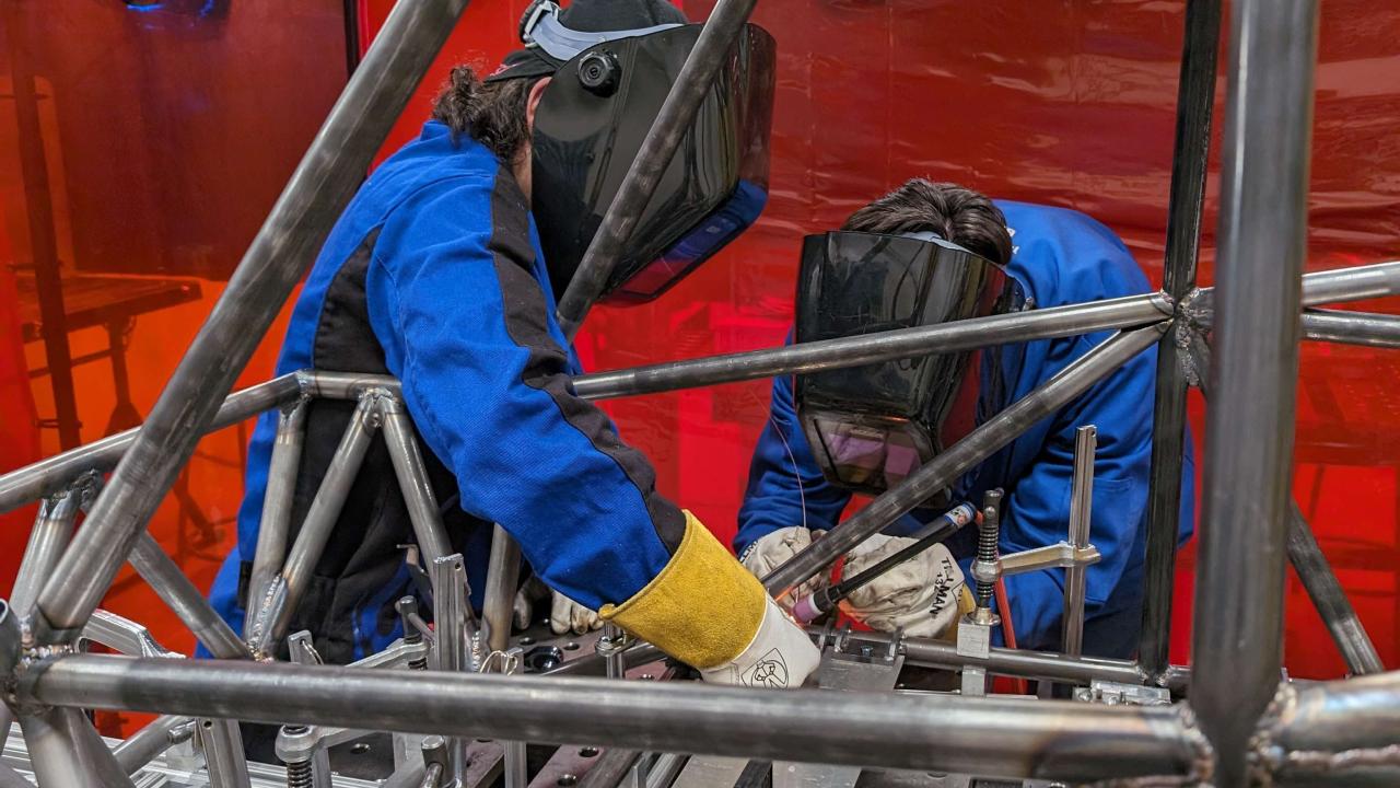 Photo of students welding